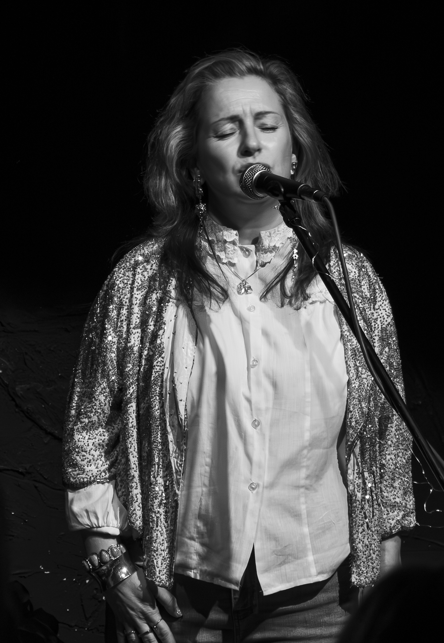 Maggie May Treanor portrait in gold jacket, black and white